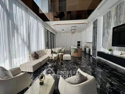 Luxurious modern living room with marble flooring and open kitchen layout