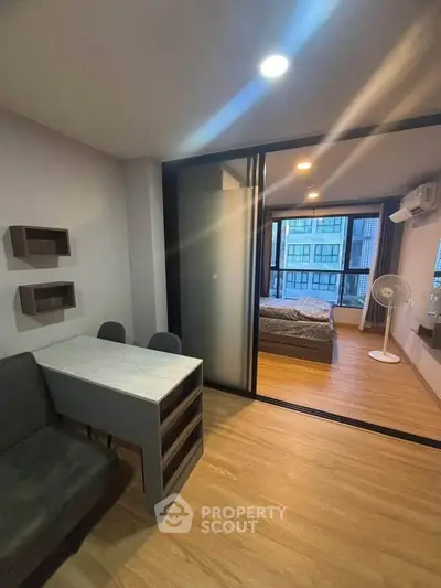 Modern apartment interior with sliding glass doors and stylish furniture