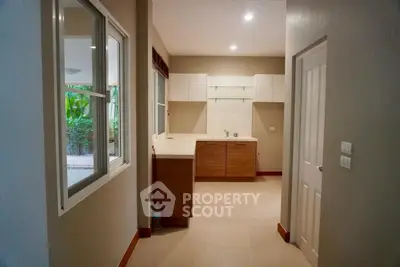 Modern kitchen with sleek cabinetry and ample natural light, perfect for culinary enthusiasts.