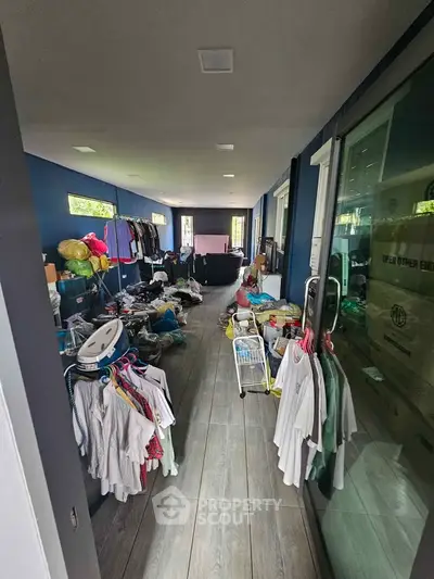 Spacious storage room with ample natural light and modern flooring, ideal for organizing belongings.