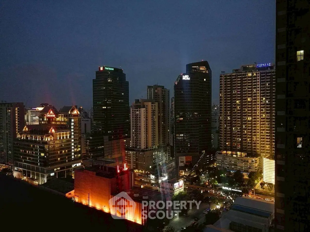 Stunning city skyline view at night with illuminated skyscrapers and bustling streets.