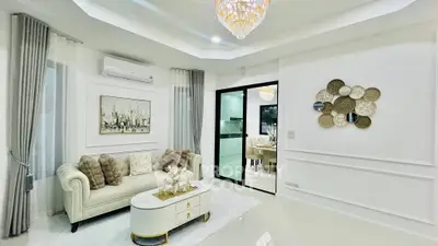 Luxurious living room with elegant decor and modern chandelier