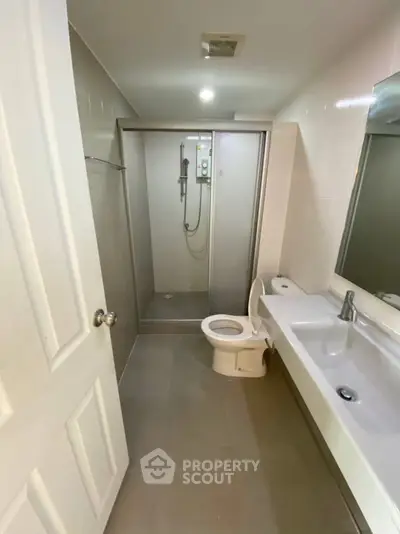 Modern bathroom with glass shower and sleek fixtures