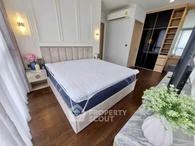 Spacious bedroom with modern decor and ample natural light