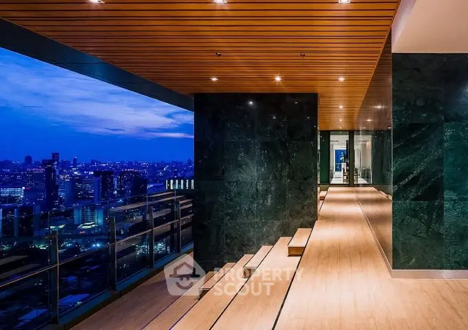 Stunning rooftop view with modern design and city skyline at dusk.