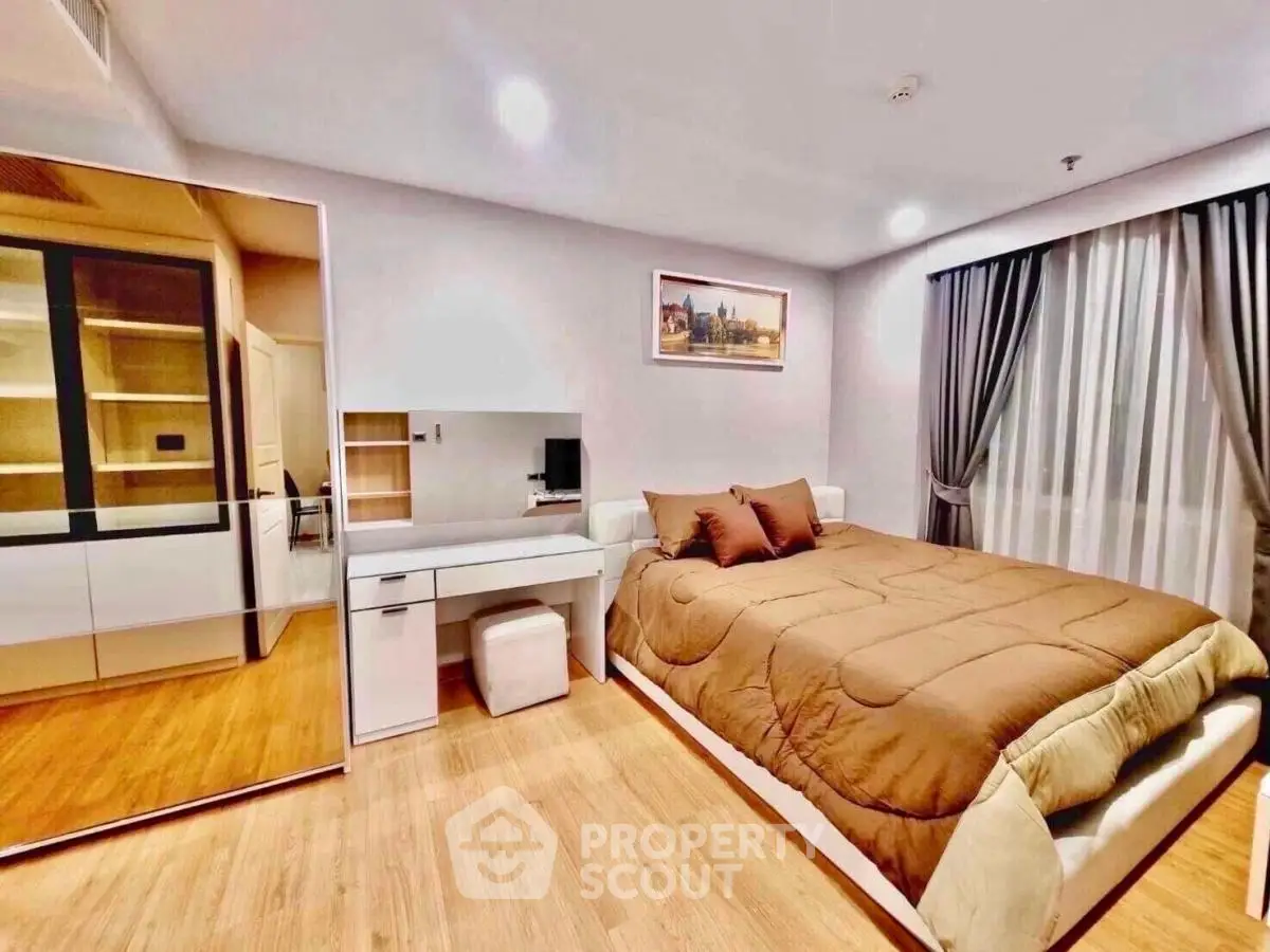 Modern bedroom with stylish decor and ample natural light