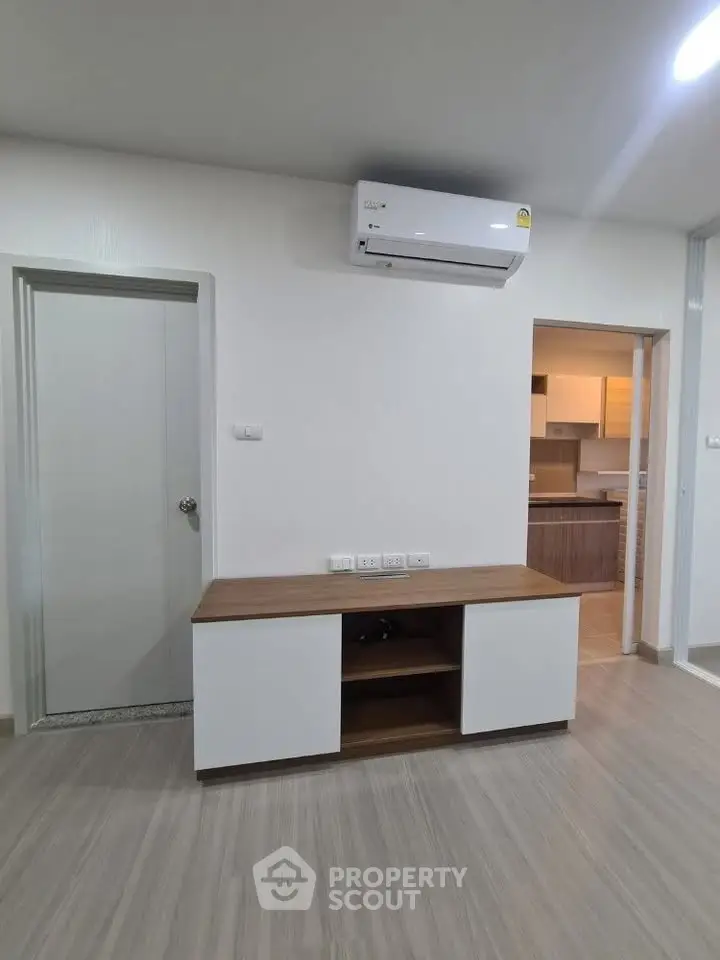 Modern living room with sleek air conditioning and stylish wooden cabinet