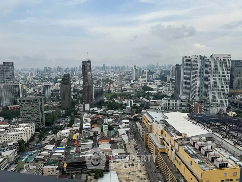 Stunning cityscape view from a high-rise building showcasing urban skyline and architectural diversity.
