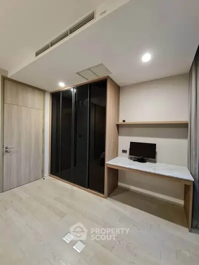 Modern study room with built-in desk and sleek wardrobe