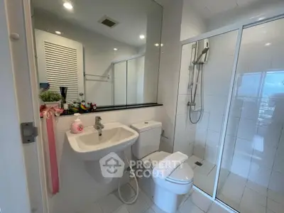 Modern bathroom with glass shower and sleek fixtures