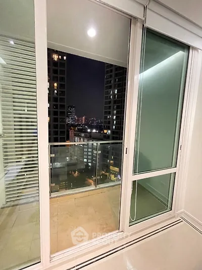 Modern balcony view with city lights from high-rise apartment