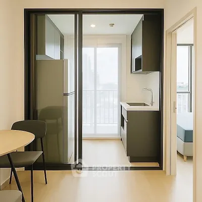 Modern compact kitchen with sleek cabinetry and city view from balcony.