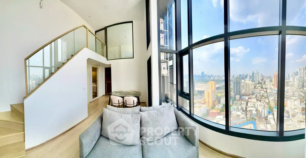 Stunning modern living room with panoramic city view and elegant staircase