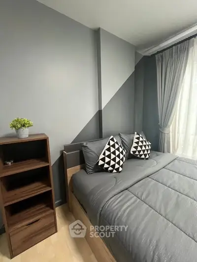 Modern bedroom with stylish decor and natural light