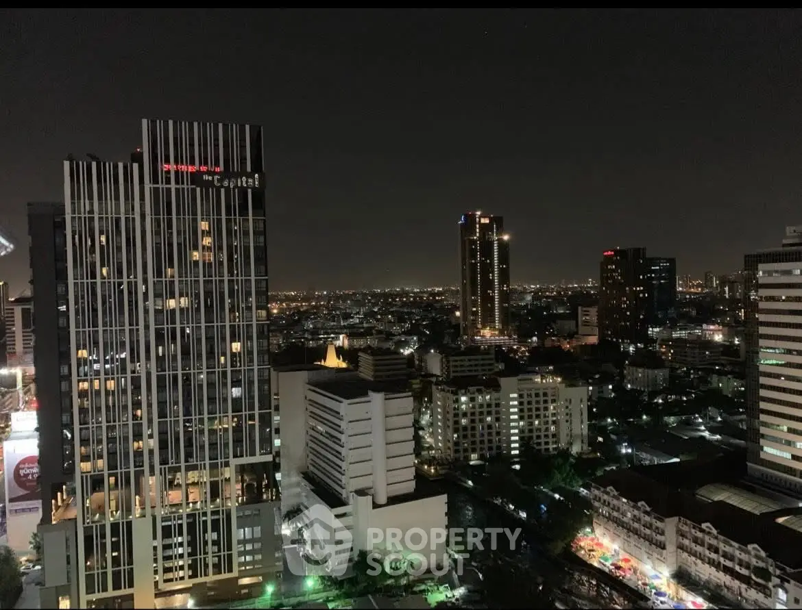 Stunning night cityscape view from a high-rise building, showcasing urban skyline and vibrant city lights.