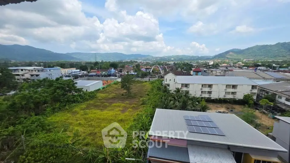 Scenic view of suburban landscape with mountains and solar panels