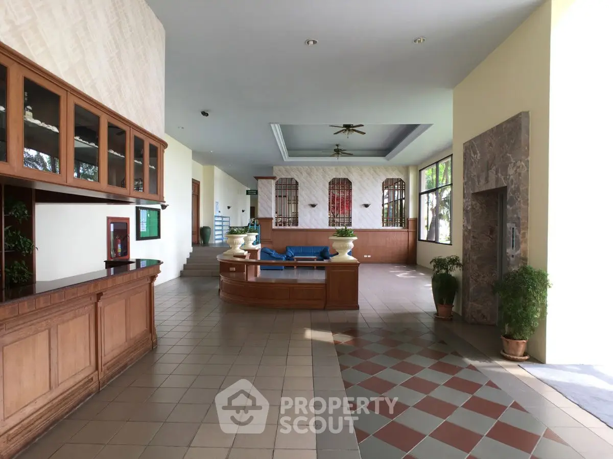 Spacious lobby area with elegant design and natural lighting