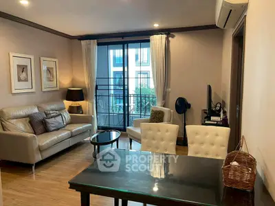 Elegant living room with modern furniture and balcony view