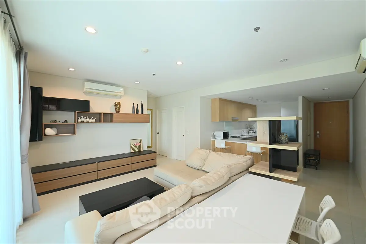 Spacious modern living room with open kitchen and stylish decor