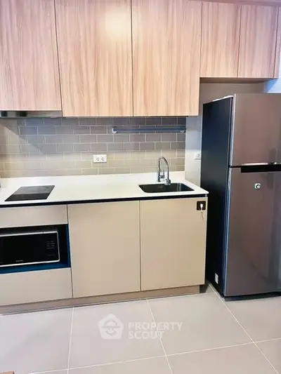 Modern kitchen with sleek cabinetry and stainless steel appliances