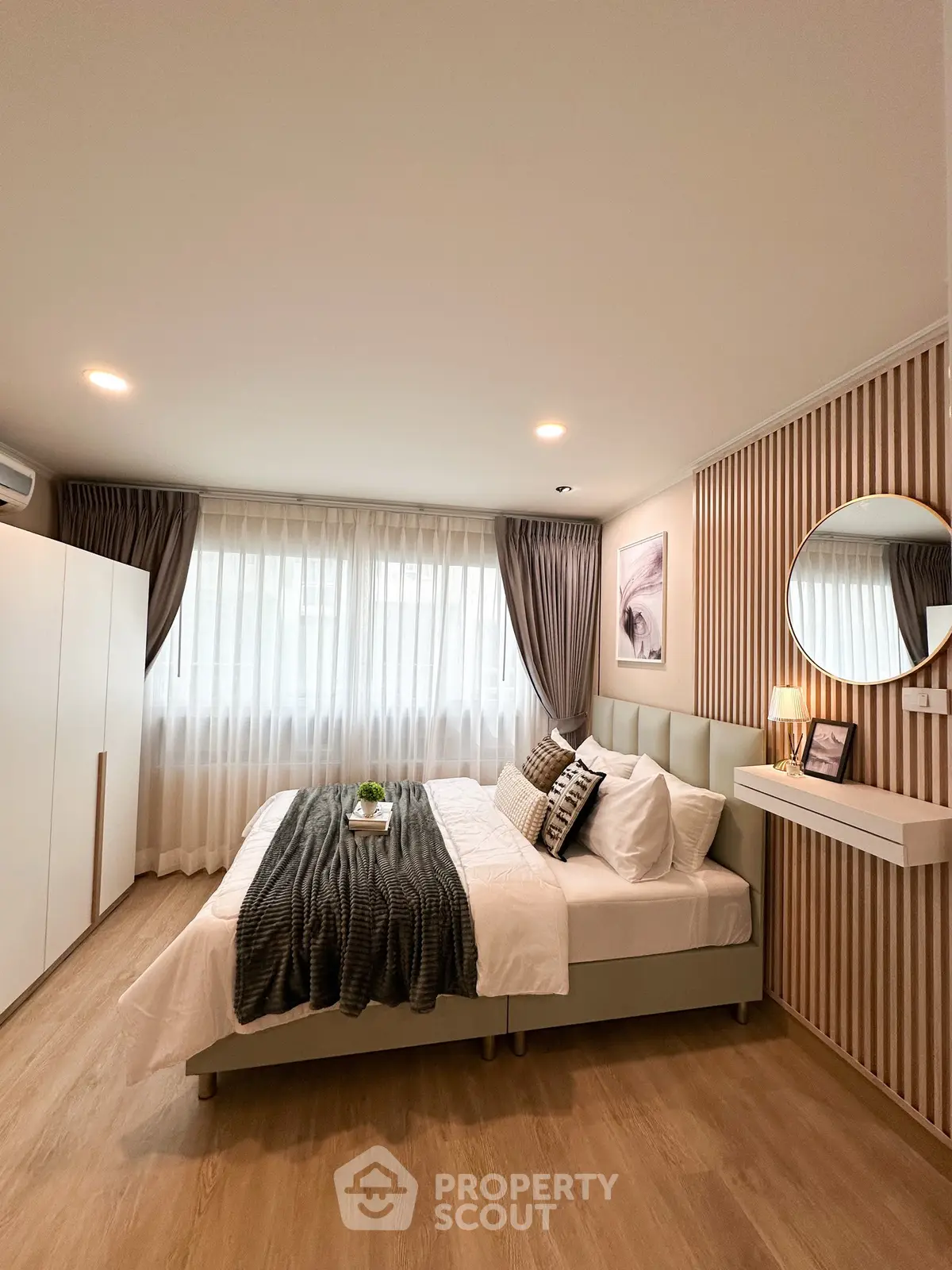 Modern bedroom with stylish decor, featuring a cozy bed, elegant curtains, and ambient lighting.