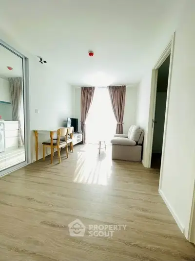 Bright and airy living room with modern decor and wooden flooring