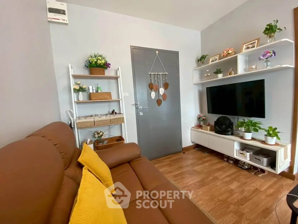 Cozy living room with modern decor and wall-mounted TV