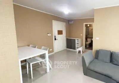 Modern living room with dining area and neutral decor