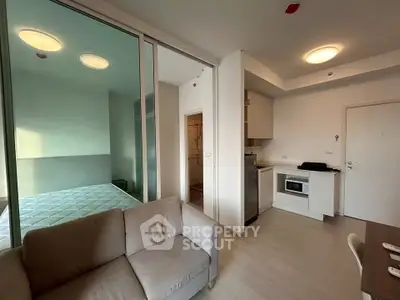 Modern apartment interior with cozy living room and compact kitchen