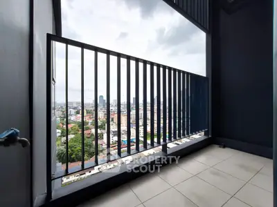 Spacious balcony with stunning city view, perfect for relaxation and enjoying urban skyline.