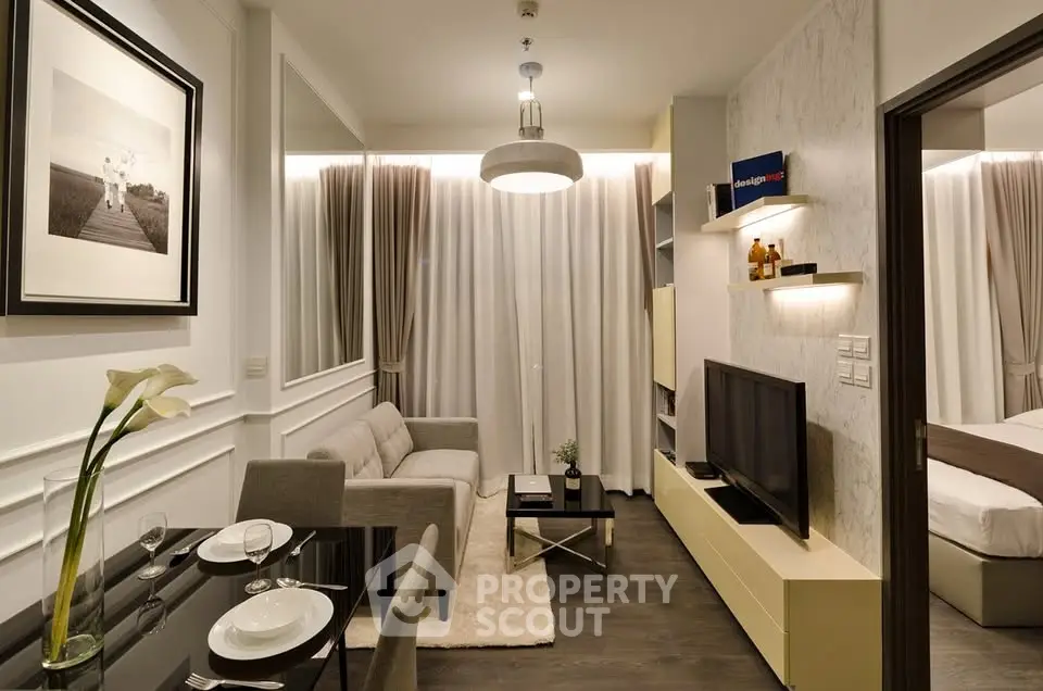 Modern living room with elegant decor and cozy ambiance, featuring a stylish sofa and wall-mounted TV.