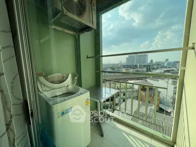 Charming balcony with washing machine and city view, perfect for urban living convenience.