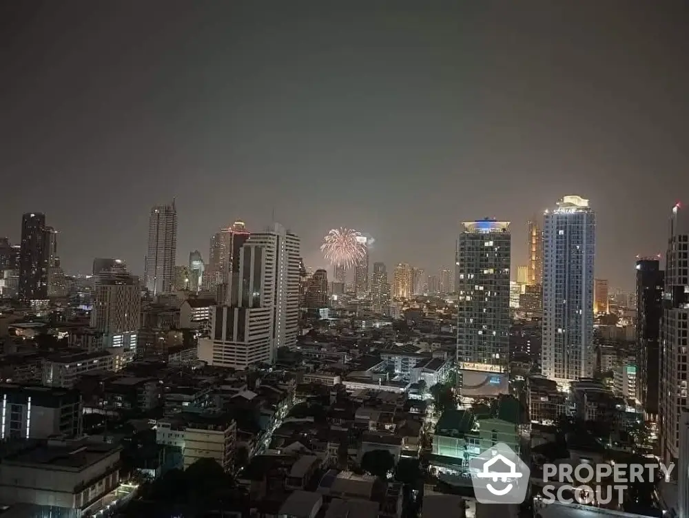 Stunning city skyline view with fireworks illuminating the night sky, perfect for urban living enthusiasts.