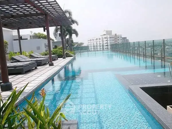 Luxurious rooftop infinity pool with stunning city views and modern lounge area.