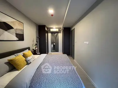 Modern bedroom with stylish decor and cozy ambiance in a contemporary apartment.