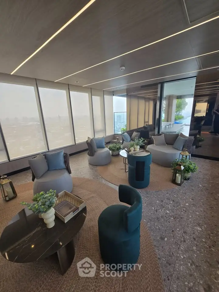 Luxurious modern living room with panoramic city views and elegant seating arrangement.