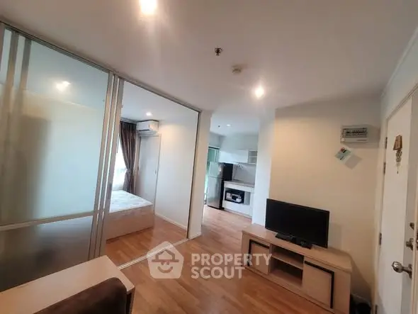 Modern apartment interior with open layout and cozy bedroom view.