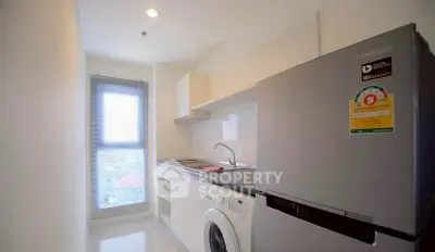 Modern kitchen with sleek appliances and natural light