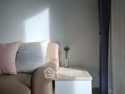 Cozy living room corner with stylish sofa and natural light