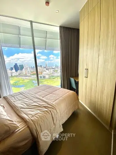 Luxurious bedroom with stunning city view and modern wooden wardrobe
