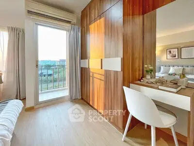 Bright bedroom with balcony access and stylish wooden accents