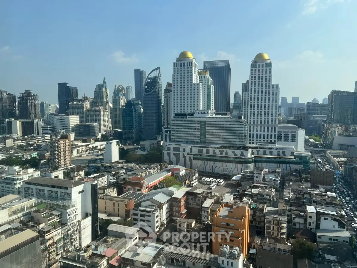 Stunning cityscape view showcasing modern skyscrapers and urban architecture under a clear blue sky.