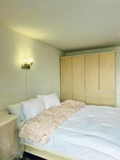 Cozy bedroom with modern wardrobe and soft lighting