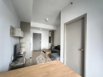 Modern living room with sleek furniture and neutral tones, perfect for urban living.