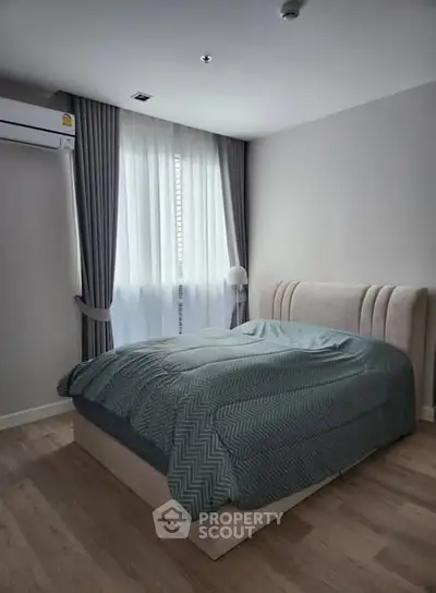 Cozy bedroom with modern decor and natural light