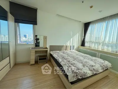 Bright and airy bedroom with city view and modern furnishings