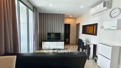 Modern living room with sleek furniture and air conditioning in a stylish apartment.