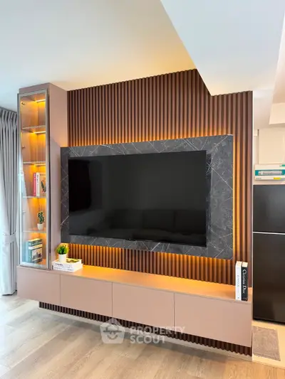 Modern living room with stylish TV wall unit and ambient lighting