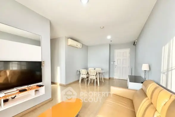 Bright and spacious living room with modern furnishings and natural light