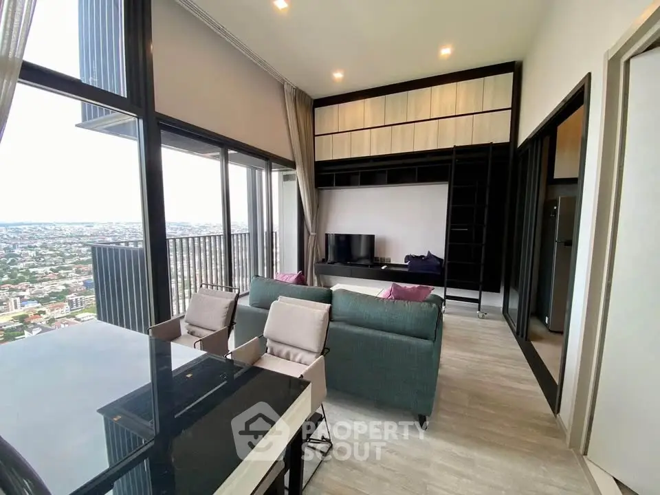 Modern high-rise living room with panoramic city view and stylish interior design.